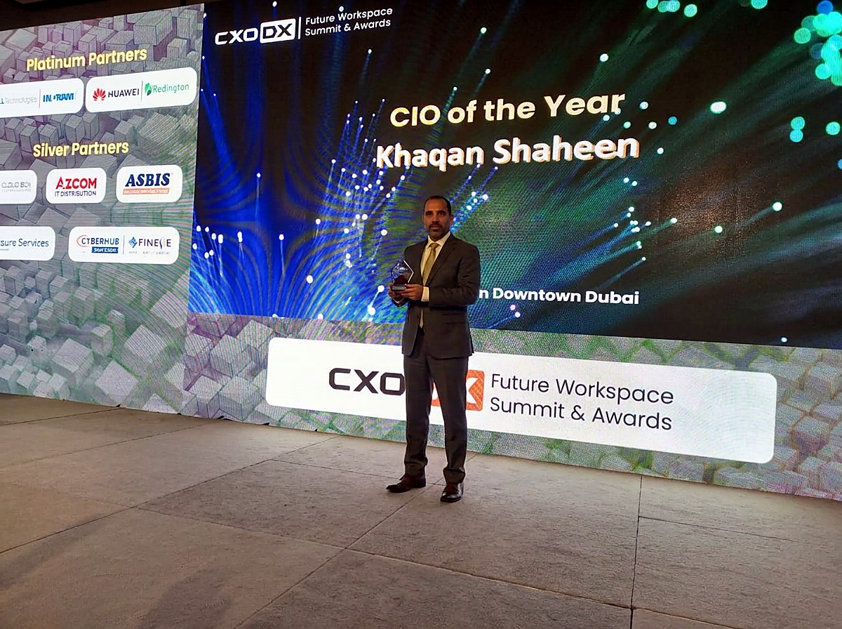 The CIO of the Year award for Khaqan Shaheen presented on stage at the CXO DX Future Workspace Summit and Awards in Downtown Dubai